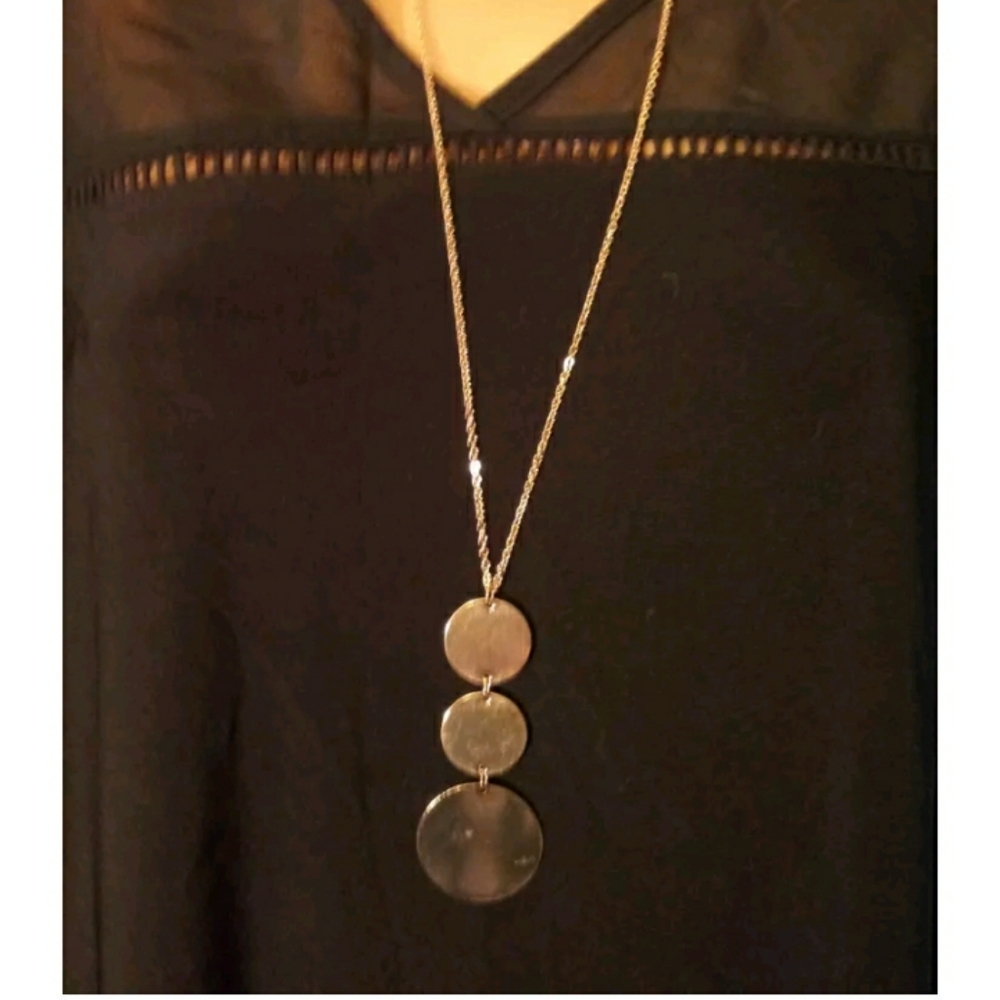 Long goldtone necklace. 3 round pendants. Very stylish. NWT.